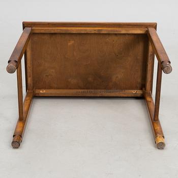 A stoneware tray table signed Bryk.