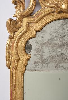 A Trasitional giltwood mirror by J. Åkerblad (master in Stockholm 1758-99).