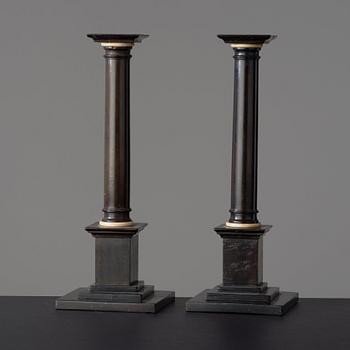 A pair of Empire early 19th century candlesticks.