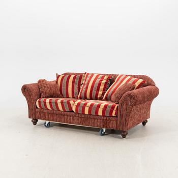 A sofa,with pillows. later part of the 20th Century.