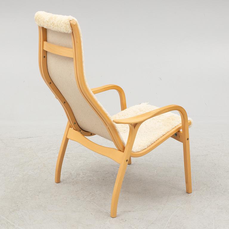 Yngve Ekström, a 'Lamino' armchair and ottoman, Swedese, 2002.