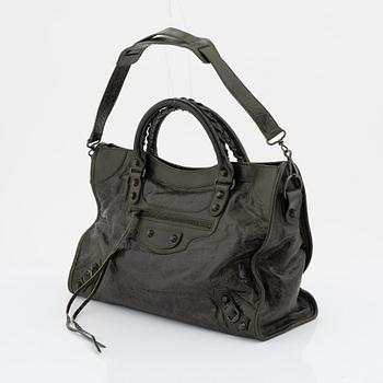 Balenciaga, a green leather bag.