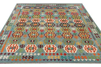 A Kilim carpet, c. 392 x 312 cm.