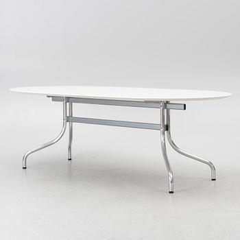 Vico Magistretti, a "Shine" dining table with twelve chairs, De Padova, Italy, around the year 2000.