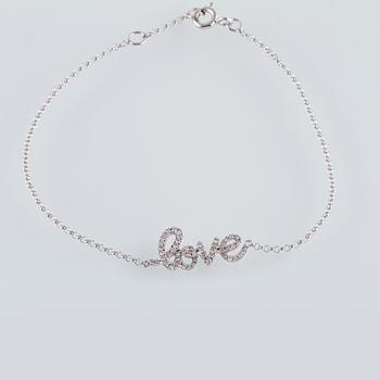 ARMBAND, 18K vitguld med briljantslipade diamanter ca 0.22 ct. Vikt 1,6 gram.