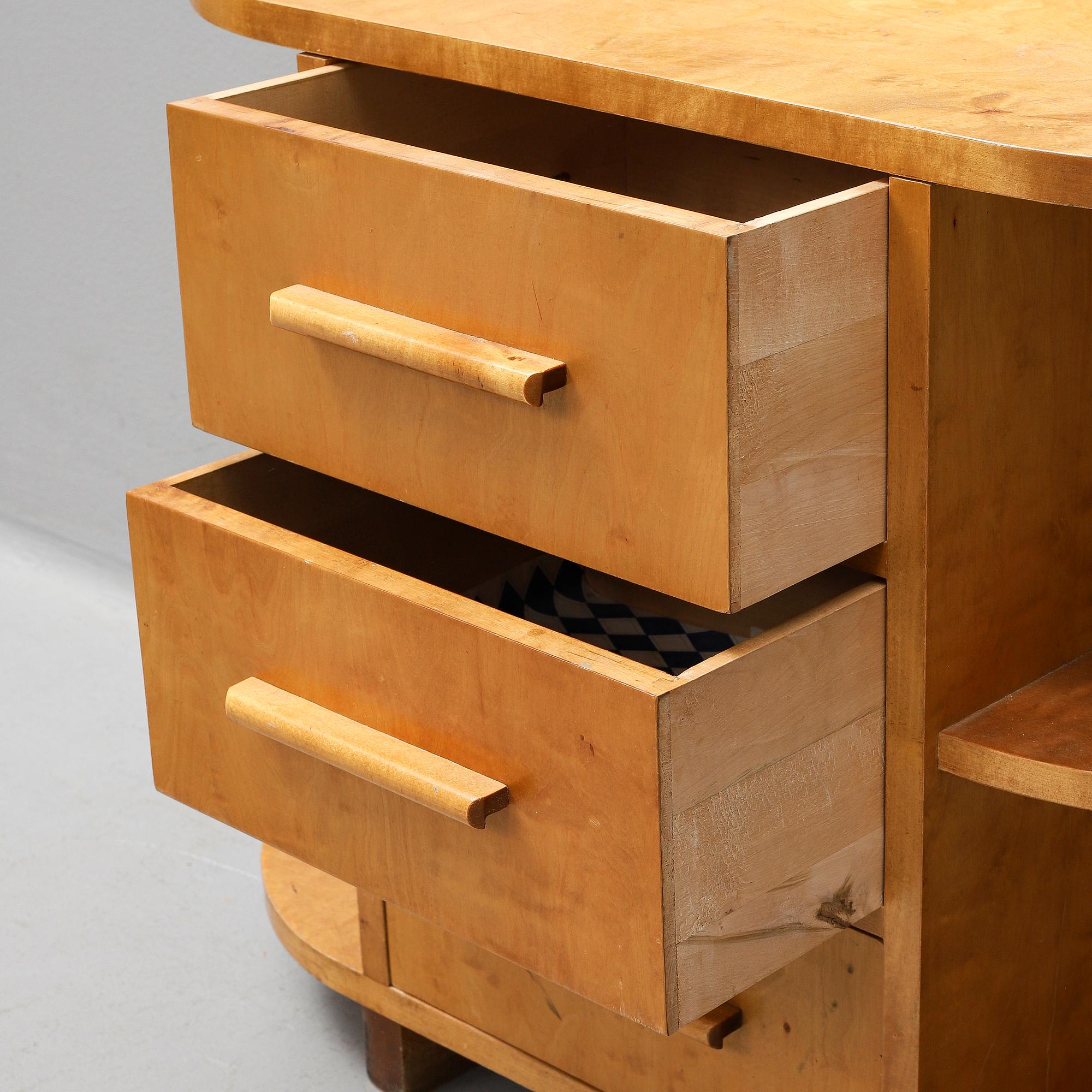 A mid 20th Century two piece birch hall furniture.