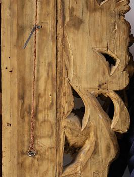 A presumably Dutch Louis XIV carved giltwood frame with mirror glass, in the style of Jean Le Pautre, late 17th century.