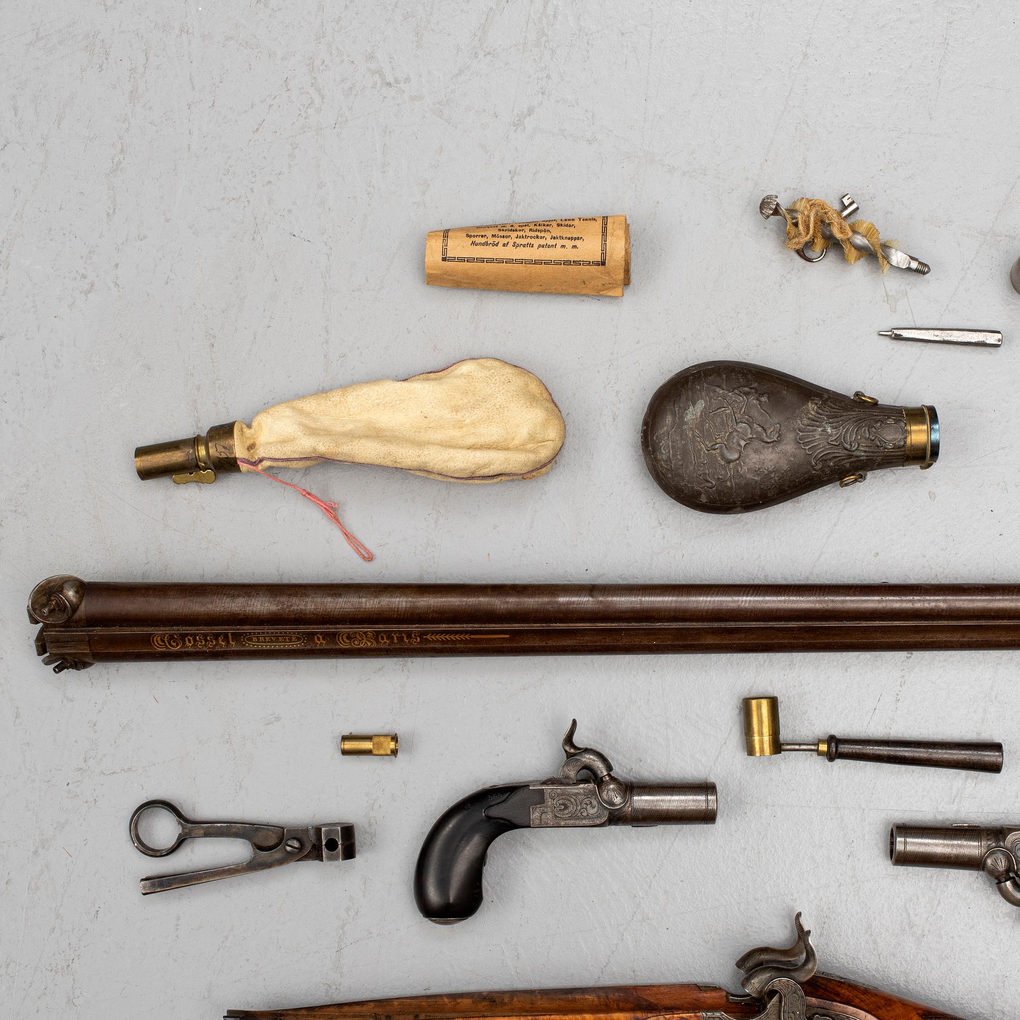 A cased double barreled percussion shotgun marked Gosset a Paris and a pair of percussion pistols marked Fni PAR LEPAGE.