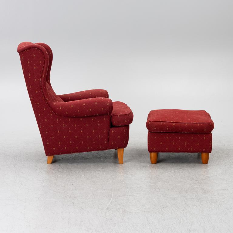 Carl Malmsten, a 'Häggbom' armchair with a 'Jättepaddan' ottoman, AB OH Sjögren, Tranås.