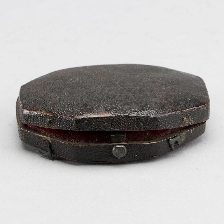 A brass travel sundial marked Le Maire et Fils Paris around 1700.