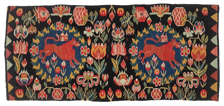 A cushion, 'Red Lion' (Rött Lejon), tapestry weave, c. 102 x 46cm, southwestern Scania, first part of the 19th century.