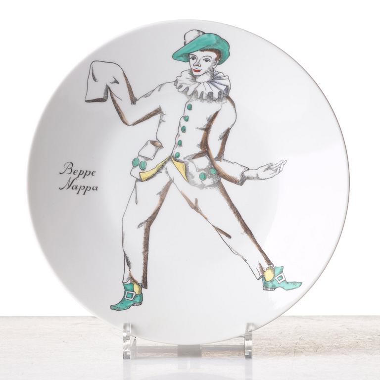 Piero Fornasetti, a set of 12 "Maschere Italiane" porcelain plates, Milan, Italy.