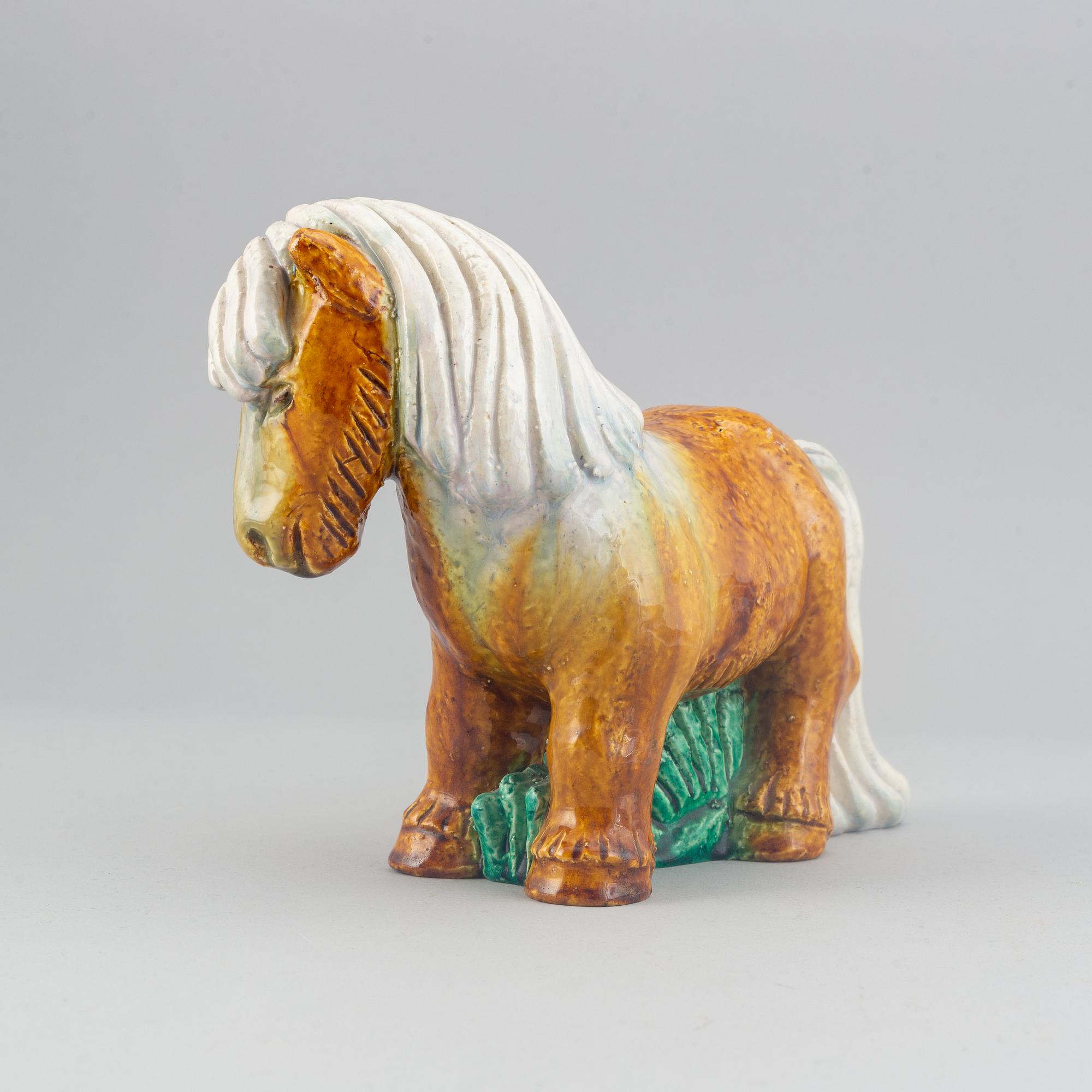 Gunnar Nylund, a stoneware sculpture of a work horse for Rörstrand signed.