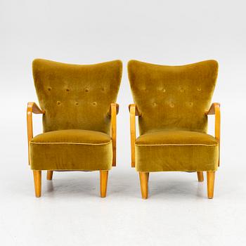 A pair of wingback armchairs, Sweden, first half of the 20th century.