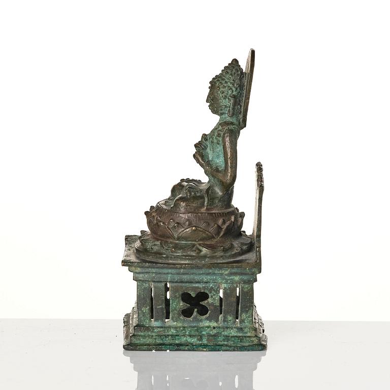 A bronze Buddha Vairocana, Eastern Java, 10th century.