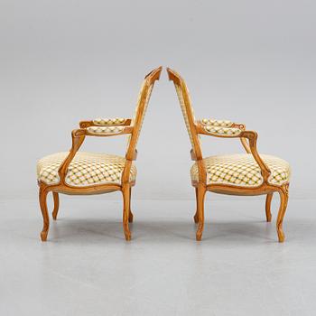 A pair of rococo style armchairs, early 20th Century.