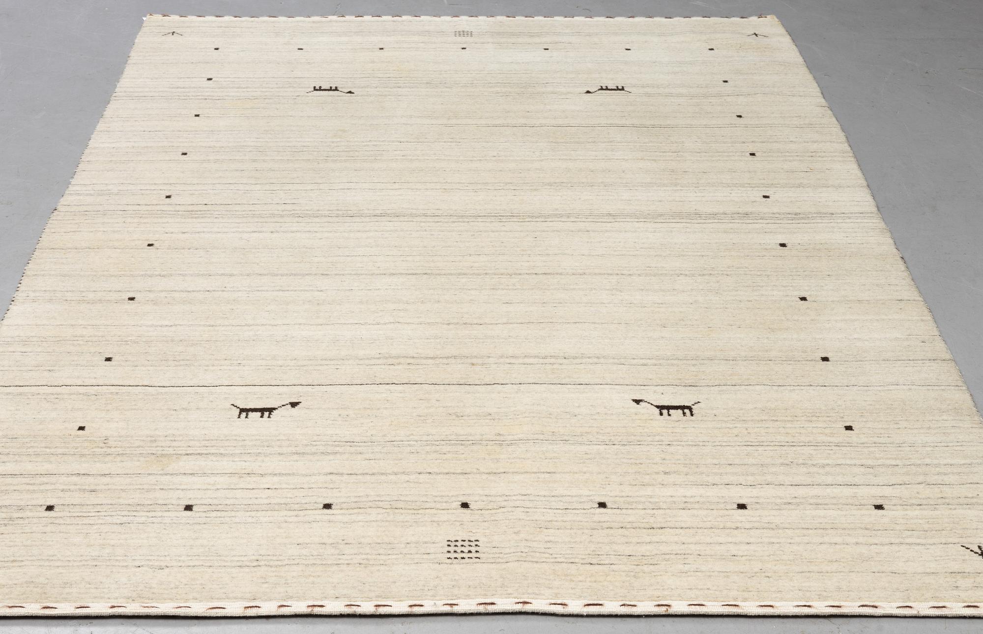 A Loribaf rug, ca 240 x 169 cm.