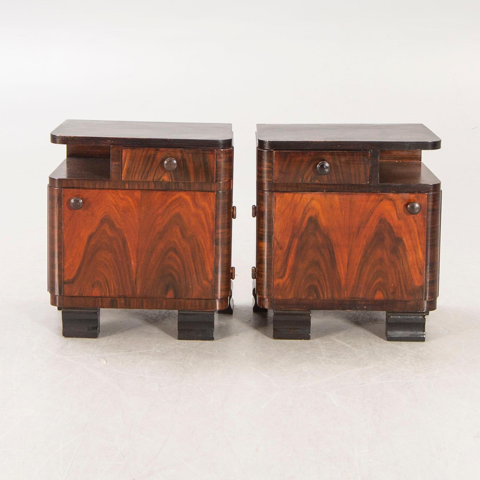 A pair of Art Deco 1940s walnut bedside talbes.