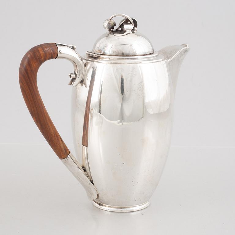 A Swedish Sterling Silver Coffee Pot, Creamer and Sugar Bowl, mark of Nordisk Silverkonst, Helsingborg 1948.