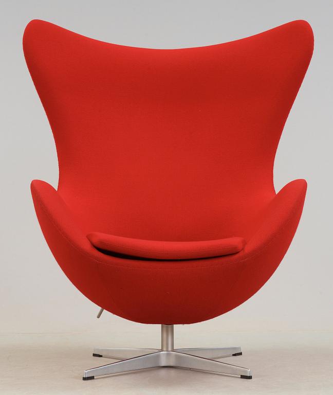 An Arne Jacobsen red fabric 'Egg' chair, Fritz Hansen, Denmark 2002.