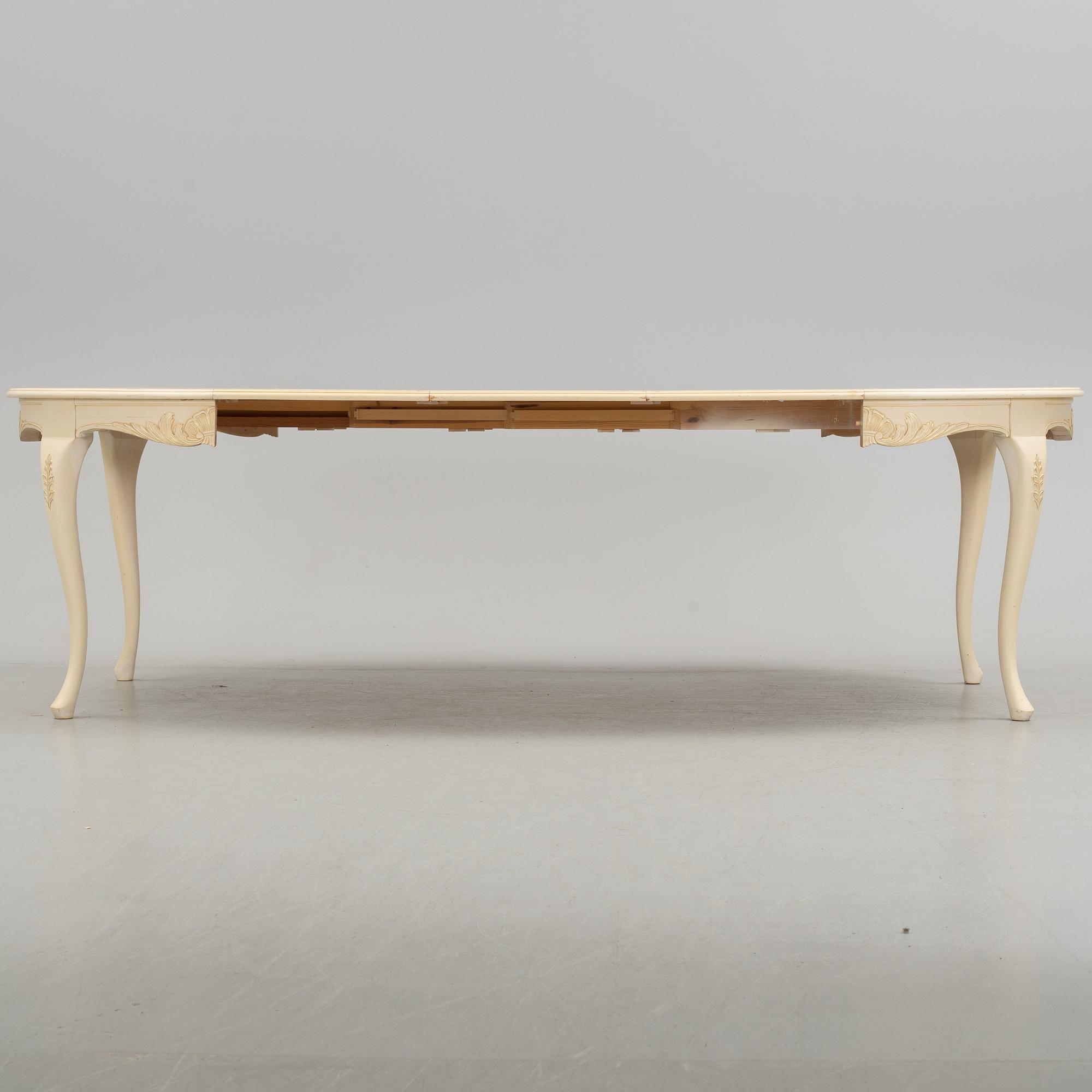 A mid 20th century rococo style dining table.