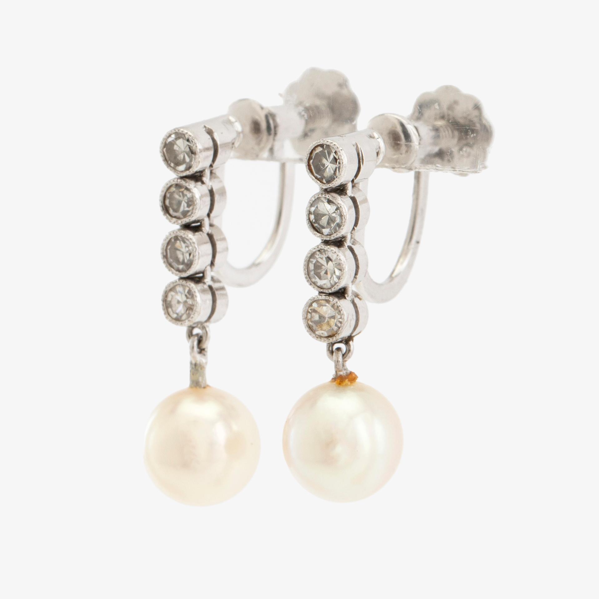 Earrings, a pair of 18K white gold set with round brilliant-cut diamonds and cultured pearls.