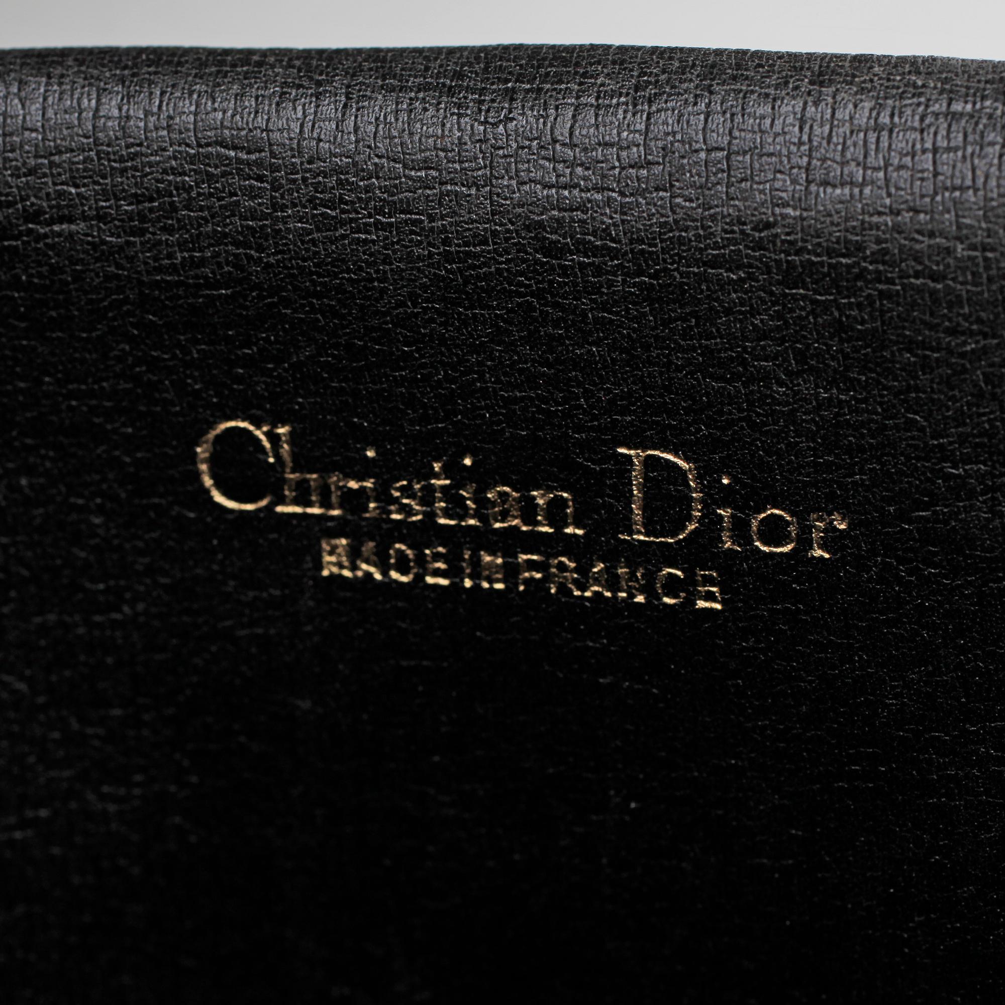 CHRISTIAN DIOR, a black monogram canvas bag and clutch bag.