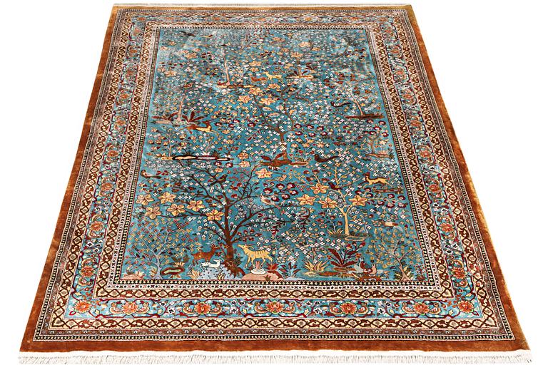 An all silk oriental carpet, a. 280 x 185 cm.