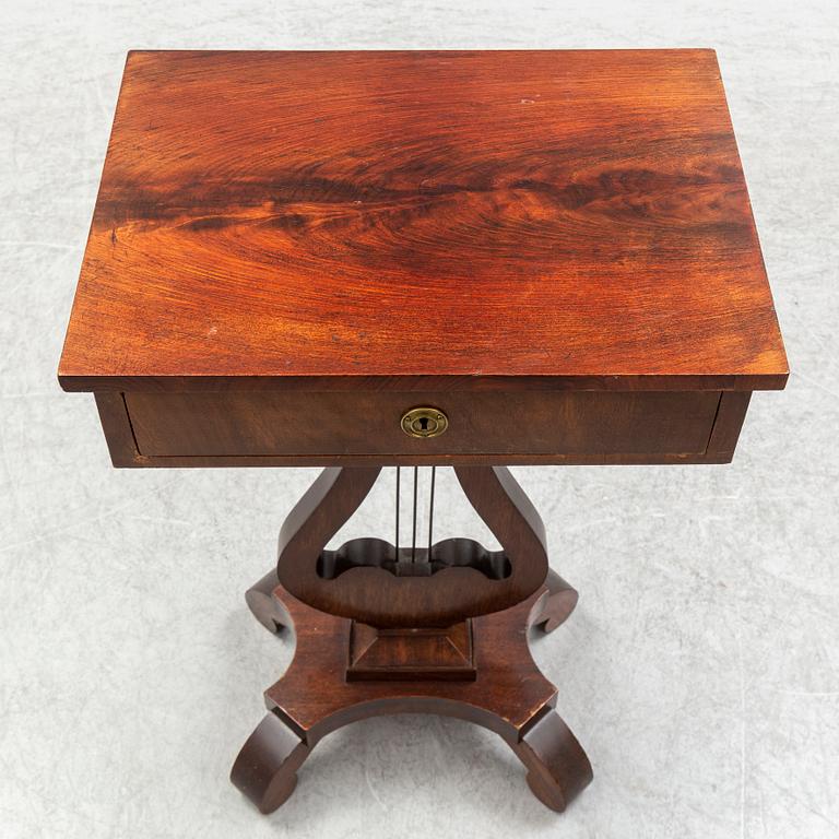 An early 20th century sewing table.