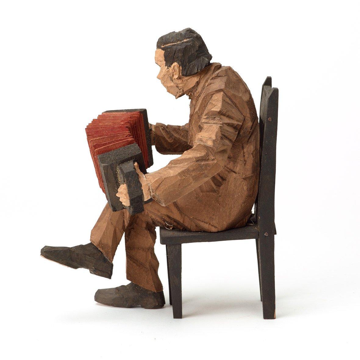 Axel Petersson Döderhultarn, Seated accordionist.