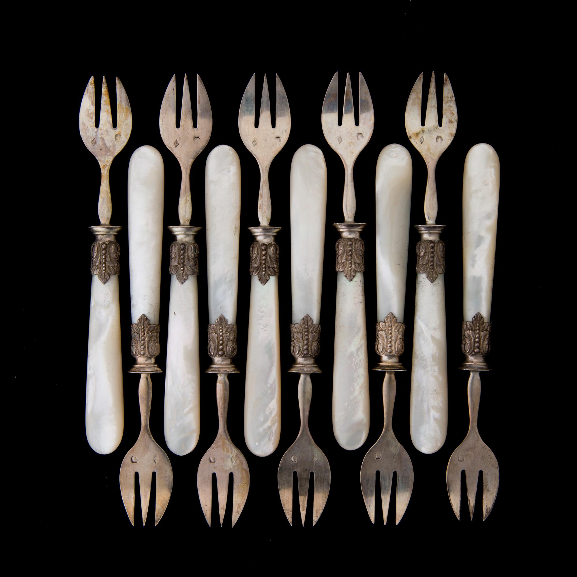 A SET OF TEN 19TH CENTURY FRENCH SILVER OYSTER FORKS, marked Charles Marseille, Paris.