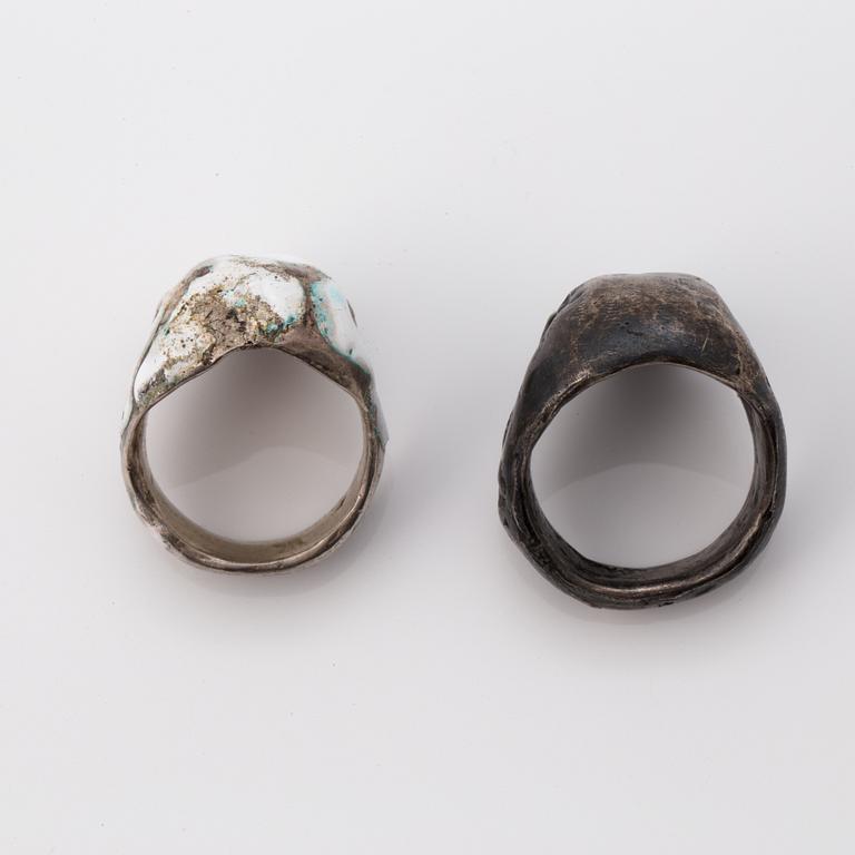 Six silver and enamel silver rings.