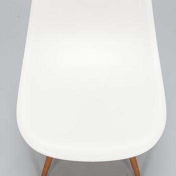 A 'Plastic chair DSW' by Charles and Ray Eames for Vitra.