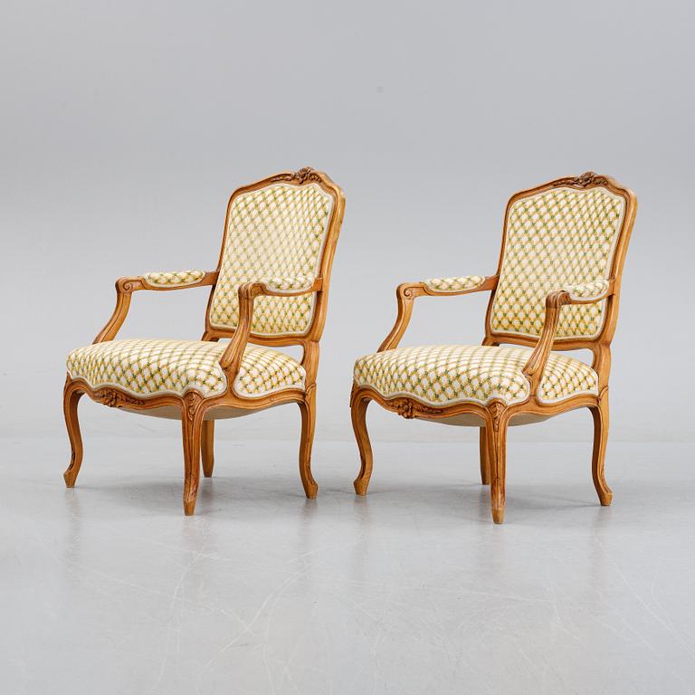 A pair of rococo style armchairs, early 20th Century.
