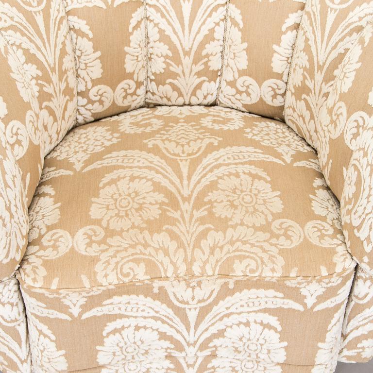 A pair of mid-20th century armchairs.