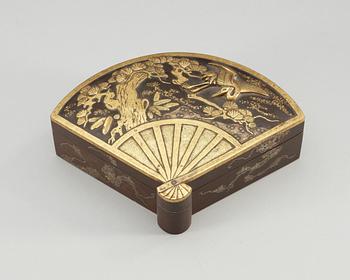 A Japanese fan-shaped gilt and silvered bronze box with cover, Meiji, circa 1900.
