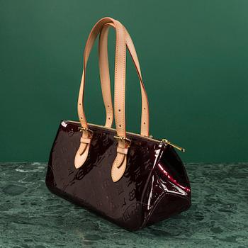 A Louis Vuitton bag,  "Rosewood Avenue Amarante".