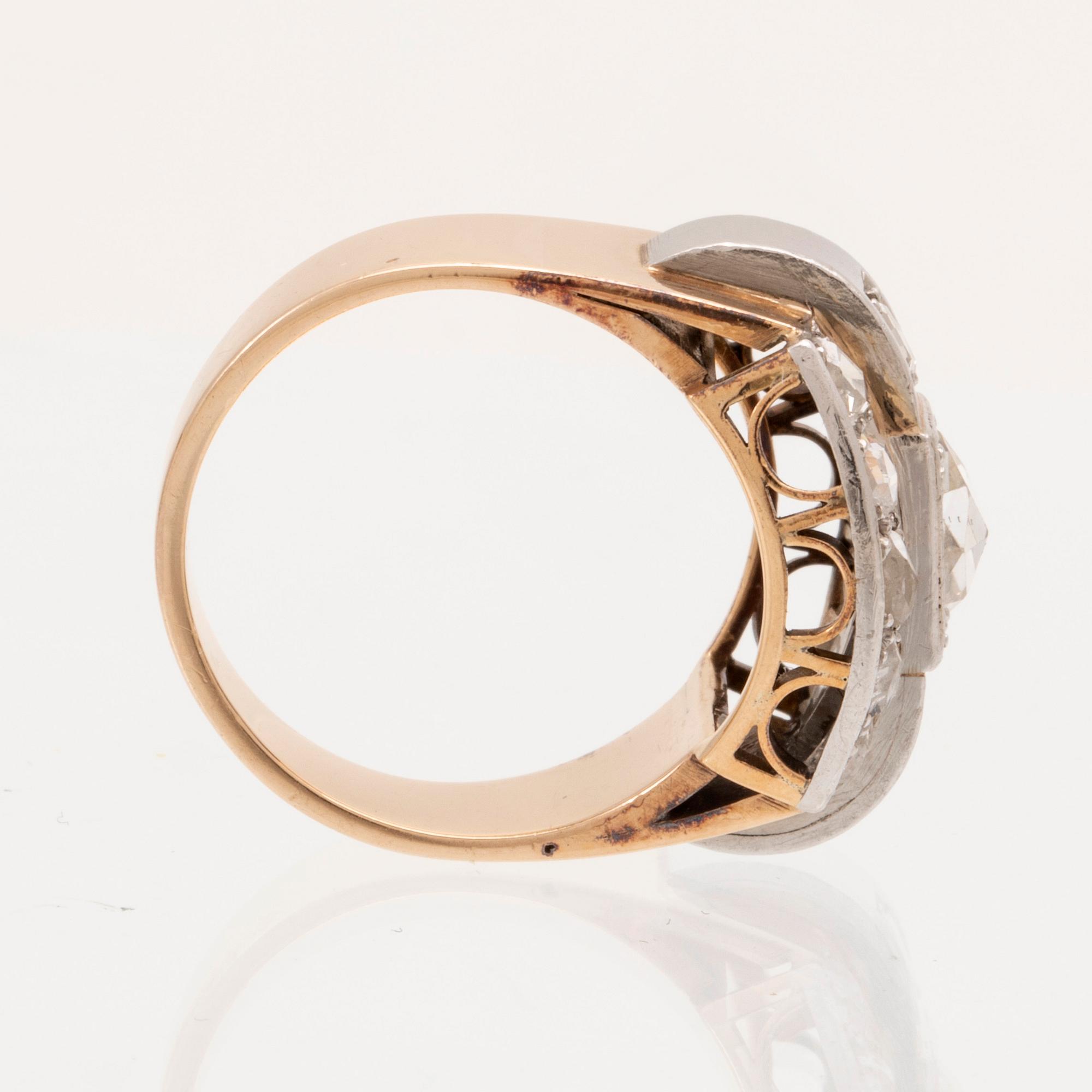 An 18K white and red gold ring set with rose cut diamonds.