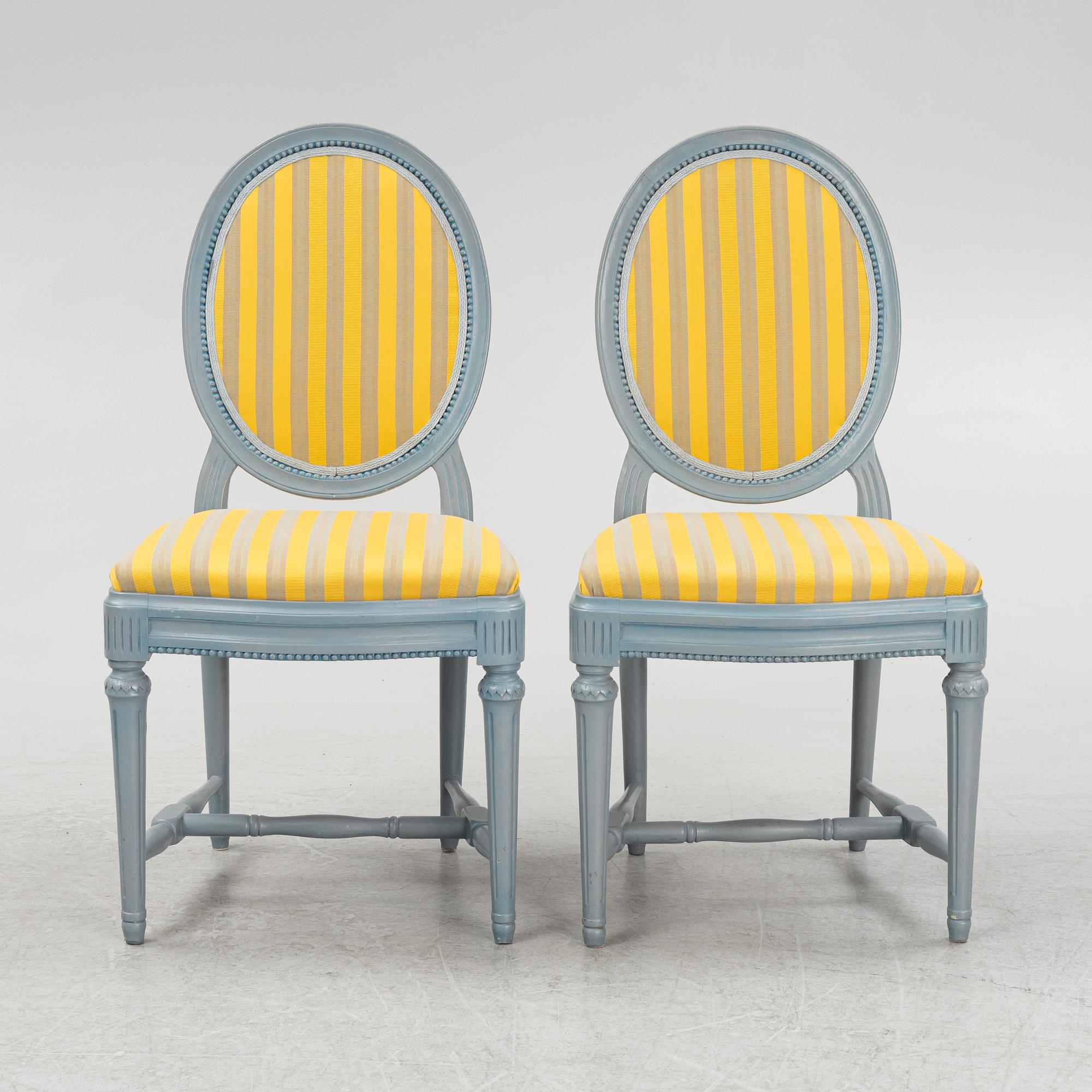 A painted sofa, table, a pair of chairs, a pair of armchairs, a pair of stools, Gustavian style, 20th Century.