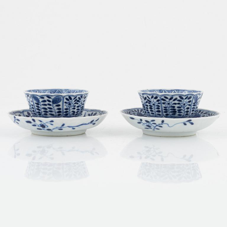 Nine blue and white Kangxi-style porcelain cups with saucers, China, late Qing dynasty.