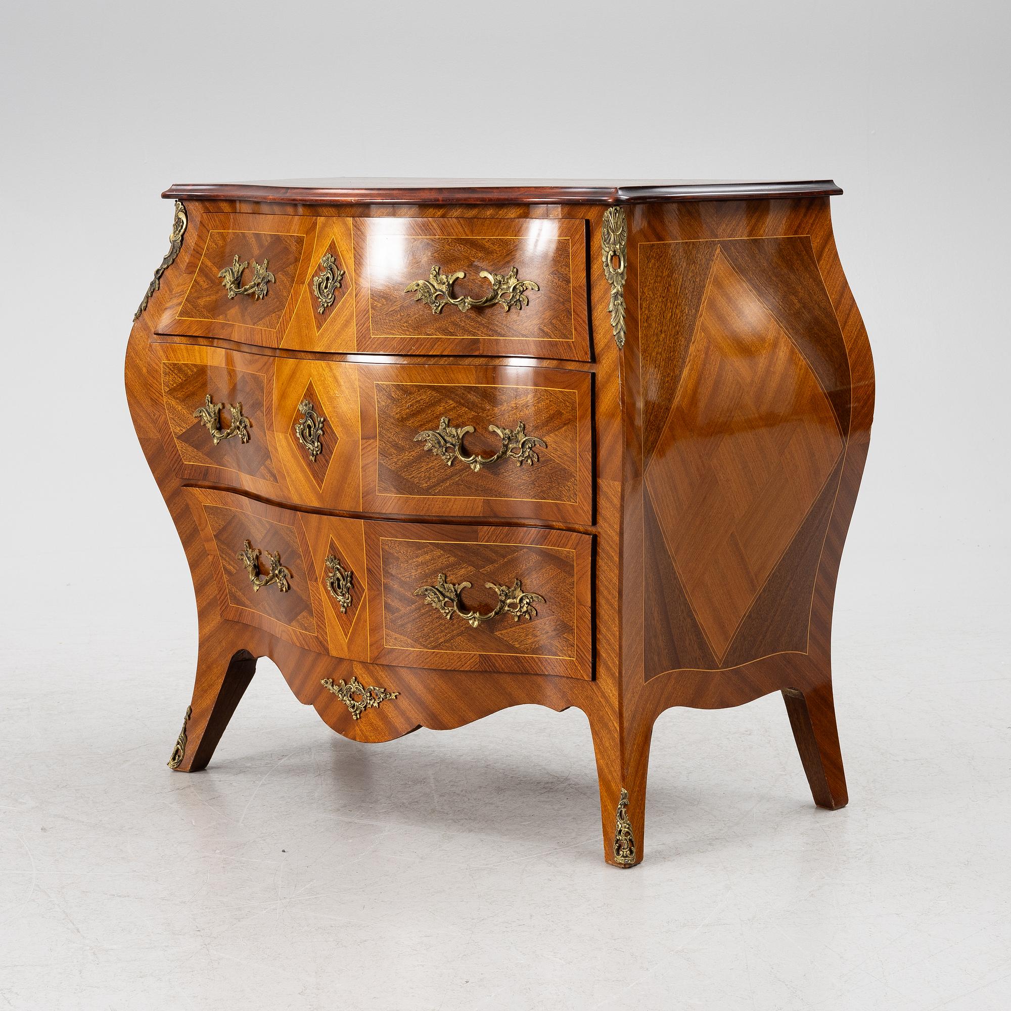 A Rococo style chest of drawers, mid-20th century.