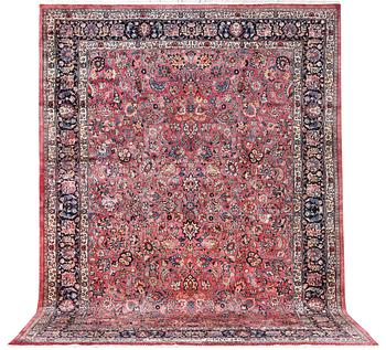 An antique Mashad carpet, signed Saber, a. 405 x 295 cm.