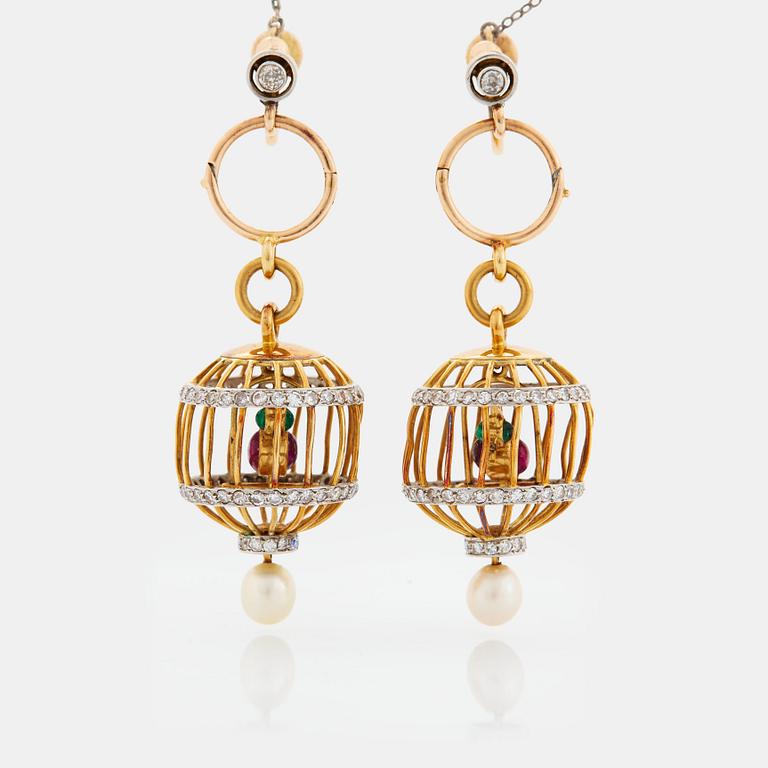 A pair of 18K gold birdcage earrings set with eight-cut diamonds, rubies and emeralds.