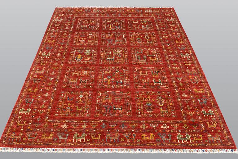 A rug, Ziegler design figural, ca 235 x 168 cm.