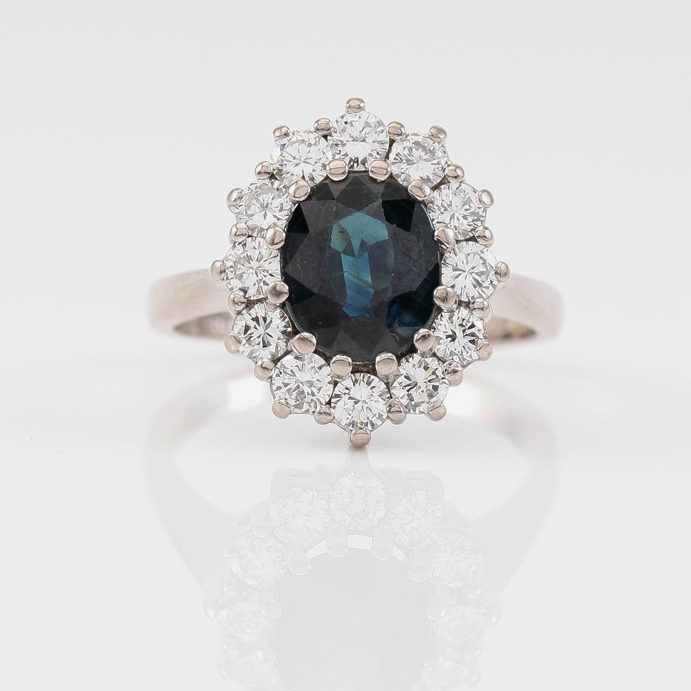 RING, 18K vitguld, blå safir, briljantslipade diamanter tot ca 1.00 ct, svenska stämplar SGG, Stockholm 1991.