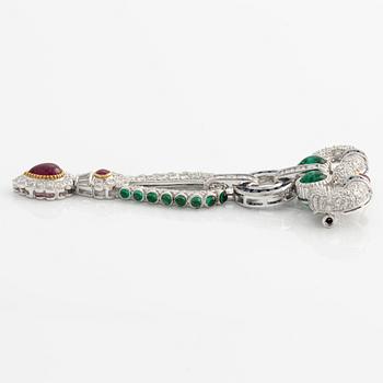 Brooch, white gold with cabochon-cut emeralds, rubies, sapphires, and brilliant- and square-cut diamonds.