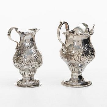 Two creamers, a tray, and a sugar tongs, silver, Rococo and Rococo style, 18th-19th century.