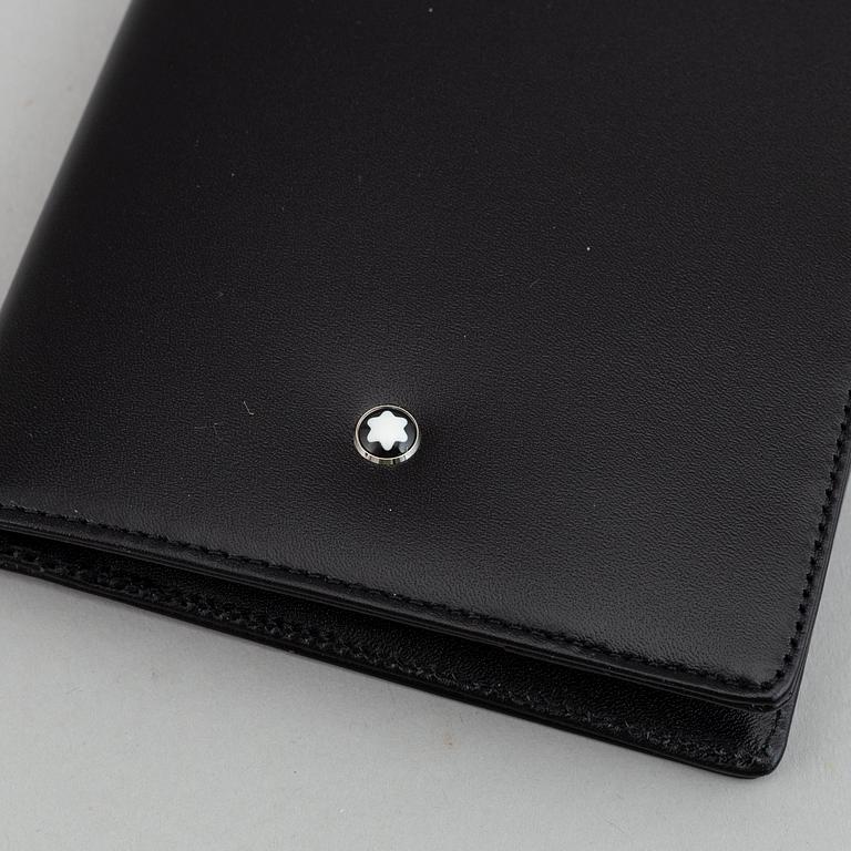 MOntblanc, a ball point pen and leather passport holder.