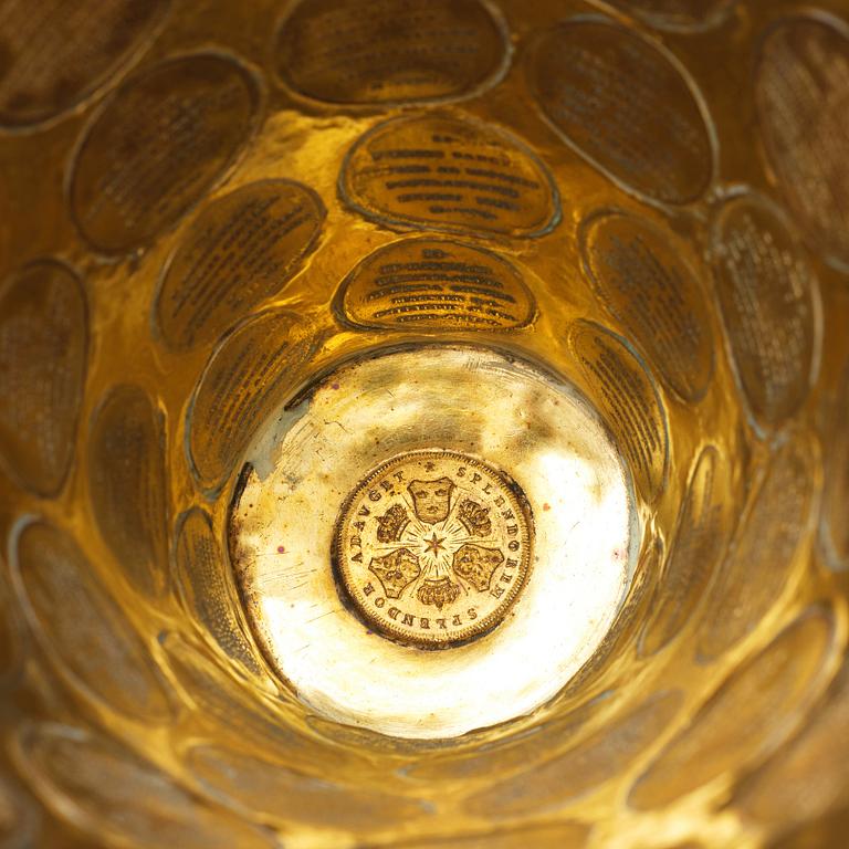 A Swedish 18th century parcel-gilt silver coin-beaker.