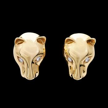 319. CUFFLINKS, shape of panthers head, gold with brilliant cut diamonds, tot. app. 0.12 ct. Weight 13 g.